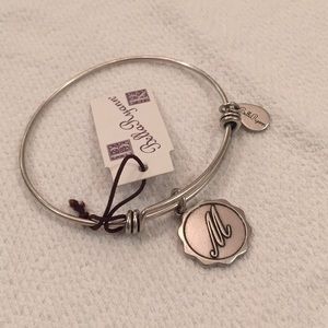 Silver Bracelet with “M” charm.